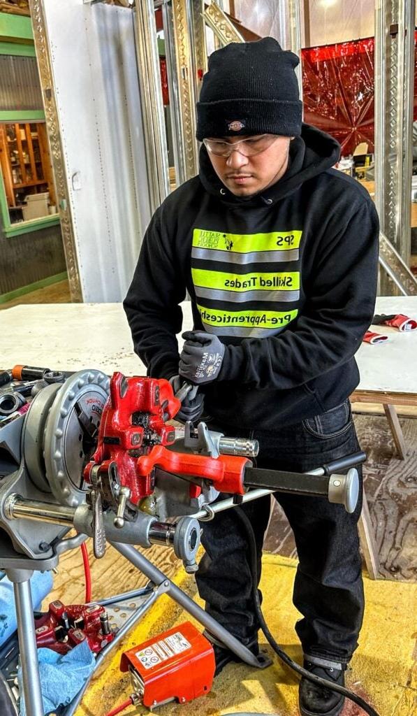 student working on an engine