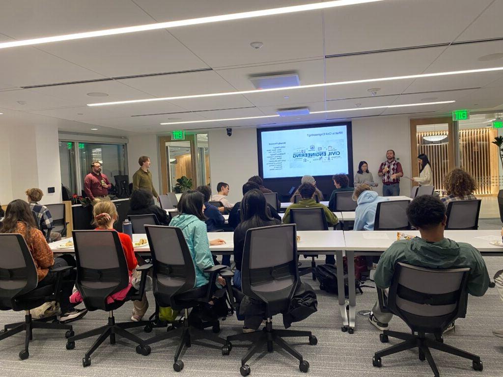 Students sit in front of powerpoint presentation on careers in civil engineering